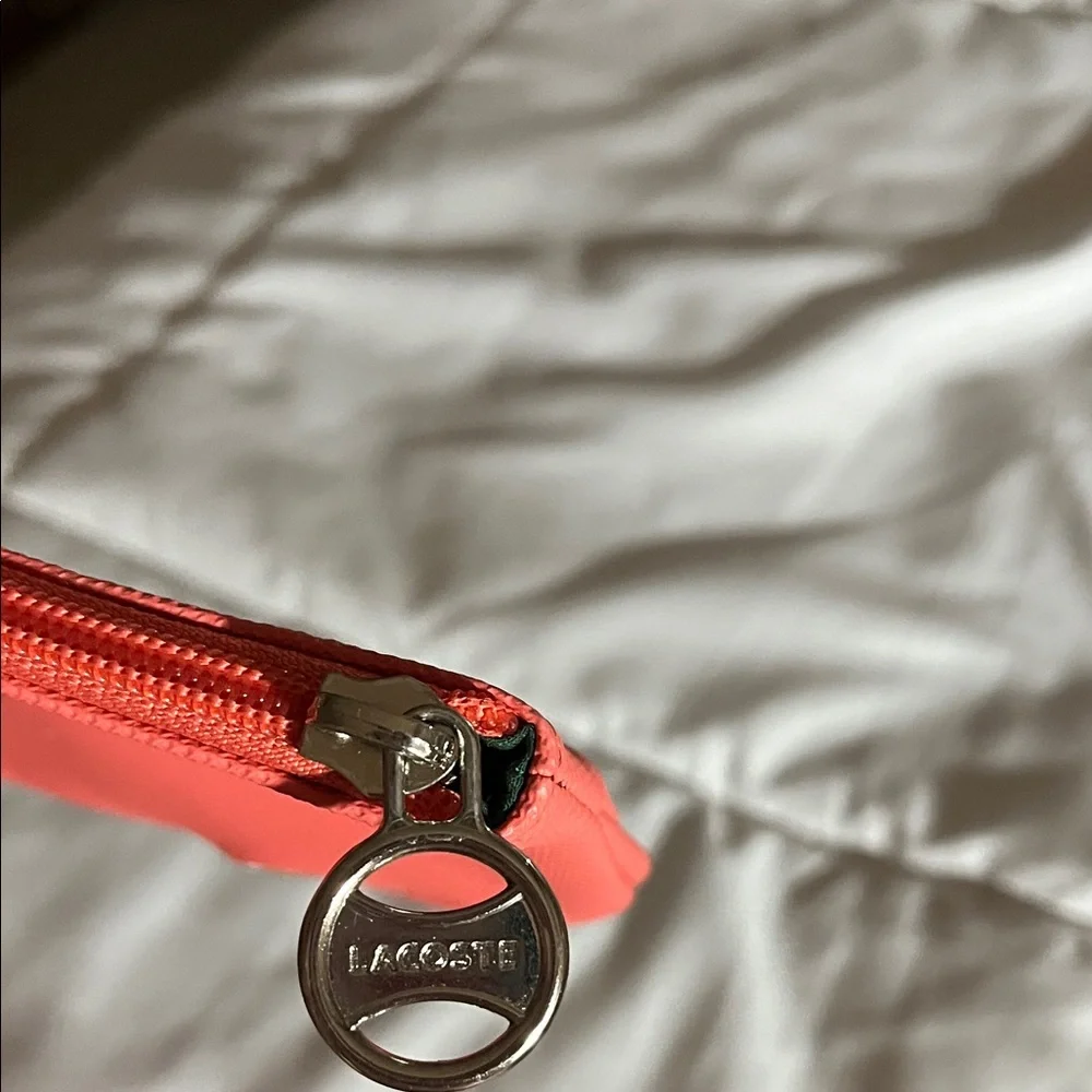 Coral color Lacoste Women's Vibrant Coral Wristlet - Picture 2 of 5